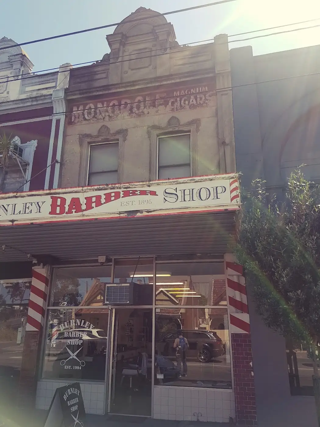 Burnley Barber Shop sign and barber poles